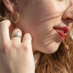 Closeup of rings and hoop earring